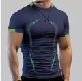 Detail macro view of men's quick-dry compression sports t-shirt in navy and lime green - Navy Blue
