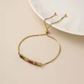Pulsera de acero de titanio dorado con circonitas de colores y cadena ajustable - Pulsera Dorada Ajustable con Circonita de Colores