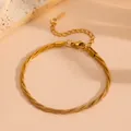 Detailed macro view of 18k gold plated braided snake chain bracelet for women - Gold Braided Bracelet (Q810)