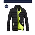Detailed view of black men's puffer jacket with vibrant lime green lining - Black Contrast Neon Green