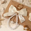 Elegant cream satin bow keychain with faux pearl bead loop and gold-tone metal hardware - Cream (ZJ16875)