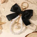 Elegant black satin ribbon bow keychain with white faux pearls on a large golden ring - Black (ZJ16876)