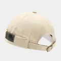 Vintage beige brimless docker hat featuring a side woven patch and adjustable metal buckle - Adjustable / EST1973 Patch Beige