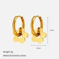 Elegant gold stainless steel hoop earrings featuring a dainty flower charm and dimensions - Hollow Flower Pendant / Gold