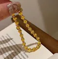 Elegant 18K gold plated titanium steel beaded bracelet featuring unique cat-eye texture - Sparkling Cat Eye Beads / Gold