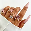 Elegant set of five gold floral rings with pink crystals and enamel rose for women. - Pink Gold Enamel Floral Pearl Ring Set (2273)
