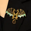 Close-up of fantasy double-headed dragon brooch with blue enamel and gold snowflake pattern - Dragon Brooch (8999) / Green