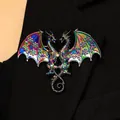 Detailed view of a fantasy rainbow double-headed dragon brooch on a black coat lapel. - Dragon Brooch (3927) / Iridescent