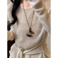 Stylish Maillard style long necklace with irregular wood bead and amber leaf pendant detail - Brown