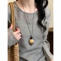 Unique irregular long cord necklace with pendant in warm Maillard style variant view - Black-Khaki