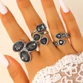 Elegant silver ring set with irregular black acrylic stones on hand - Silver Irregular Stone Rings Combination (14)