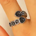 Adjustable silver-toned ring with faceted black heart-shaped crystals on finger - Silver Open Black Heart Stone Ring (11)