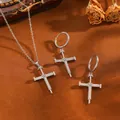 Detail view of a silver nail cross jewelry set with shimmering zircon stones and titanium chain. - Nail Cross Jewelry Set / Silver