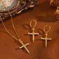 Detailed macro view of a gold cross jewelry set featuring sparkling zircon accents - Nail Cross Jewelry Set / Gold