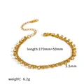 Detailed macro view of a gold stainless steel bracelet with rhinestones and small bead charms - Thin Chain Bead Rhinestone Style (TB5250) / Gold