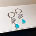 Elegante zilveren oorringen met levendige blauwe druppelstenen en fonkelende CZ-accenten - Meerblauw Waterdruppel Charm (55#)
