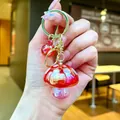 Vibrant red mushroom and apple charm keychain accessory for fashion bags and purses - Gold Hardware Electroplated Mushroom / Aurora Red