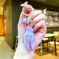Iridescent purple lobster claw keychain with star sphere charm for bag accessories. - Gold Hardware Electroplated Crab Claw / Aurora Purple