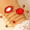 Elegant French style gold wrap bracelet featuring red oval gemstones and crystal accents - Bracelet (0932)