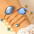 Elegant French gold wrap bangle set with oval blue gemstones and sparkling rhinestones - Bracelet (0993)