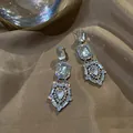 Boucles d'oreilles pendantes style palais vintage avec cristaux clairs et argent - 20# Style Gland Palais Vintage