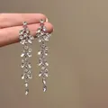 Élégantes boucles d'oreilles à pompons argentées avec cristaux et motif floral vintage - 33# Gland Long Feuille Vintage