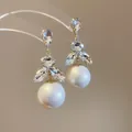 Élégantes boucles d'oreilles vintage avec cristaux scintillants et perles blanches rondes. - 57# Pendant Grosse Perle Florale Vintage