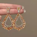 Boucles d'oreilles pendantes champagne vintage avec accents en cristal doré - 58# Gemme d'Ambre Goutte d'Eau Ajourée