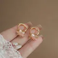 Elegant gold star huggie earrings featuring pink cat's eye stone and sparkling zircons - Sweet Cool Star Ear Buckle (HE33856) / Gold-Pink