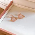 Close-up of elegant rose gold deer antler ear clips with pink cat's eye stones in a box - Antler Design Cat's Eye Clip-on Earring / 1 Pair/Pack / Gold-Pink