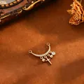 Detailed view of a gold moon pendant with pavé zircons and hanging cross charm. - Cross Round Bead Pendant (T074) / Gold