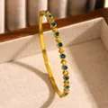 Elegant bohemian gold stainless steel bangle adorned with vibrant round blue rhinestones - Blue Rhinestone (01 Gold) / Gold