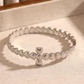 Vintage silver stainless steel heart bracelet featuring a textured clover design pattern - Heart Cross Flower (18 Silver)