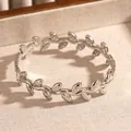 Elegant vintage bohemian stainless steel leaf bangle featuring sparkling inlaid rhinestones - Leaf Wrapping (21 Silver)
