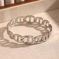Silver-toned chain link bangle with Hermès-style anchor motif on textured base. - Anchor Chain Pig Nose (22 Silver)