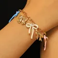 Close-up of cute colorful enamel bow charms on gold chain bracelet for women - Bracelet (A-625) / Gold
