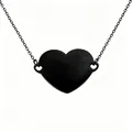 Close-up detail of the black stainless steel heart-shaped necklace pendant. - Black