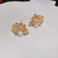 Detail view of gold-tone floral ear clips with sparkling zircons and pearls - 1# Ear Clip-Gold