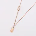 Close-up of 18k gold plated stainless steel necklace with small gold bar pendant - Rose Gold