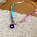 Detailed view of vibrant rainbow crystal beaded necklace with blue flower pendant on mat - Multicolor-Dark Blue (30#)