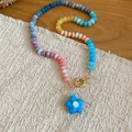 Macro view of a colorful beaded necklace with a blue flower pendant and gold clasp - Multicolor-Sky Blue (31#)