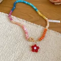 Vibrant rainbow crystal beaded necklace with cute red flower pendant on a woven mat. - Multicolor-Red (28#)