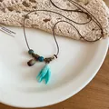Detailed view of the vibrant blue tulip pendant and vintage beads on leather cord - Blue Tulip Dried Fruit Style (32#) / Blue