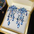 Close-up of elegant blue crystal chandelier earrings in a golden jewelry box - 21# Silver Earring Post - Blue
