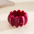 Close-up of red marbled acrylic elastic bracelet with irregular petal-shaped segments - Irregular Oval Petal Spliced Elastic Bracelet / Rose Red
