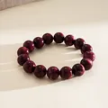 Detailed view of dark red acrylic cat-eye bead elastic bracelet on a neutral surface - Elastic Round Bead Connected Bracelet / Rose Red