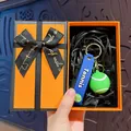 Creative tennis ball keychain in a stylish gift box with a blue strap - Tennis Ball / Orange Gift Box