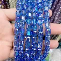 Macro detail of faceted 8*9mm cylindrical blue glass crystal beads for DIY jewelry. - Cylinder / Light Blue AB