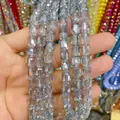 Detailed macro view of faceted 8x9mm cylinder glass crystal beads for DIY jewelry making. - Cylinder / Light Blue Gray