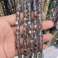Macro detail of 8x9mm faceted cylindrical smoke grey glass crystal beads for DIY - Cylinder / Smoke Gray